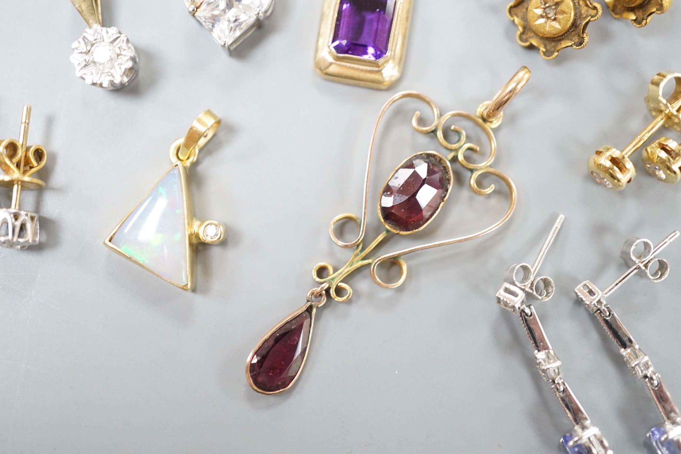 Mixed jewellery including a pair of Victorian 15ct and diamond chip earrings, a modern amethyst pendant, a garnet set yellow metal pendant, two pairs of 750 and diamond set ear studs, a pair of 750 white metal, tanzanite